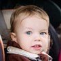 cute small children in car seats in the car