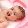 Pretty baby in the bath with foam